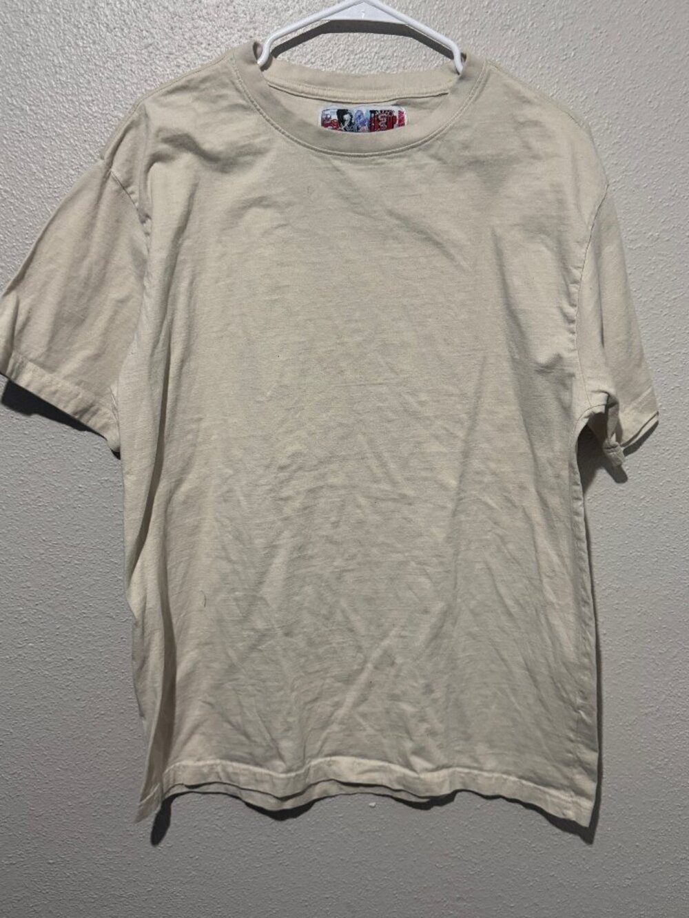 Y2K Style short-sleeve crewneck T-shirt with a distinctive multicolor “REBEL”